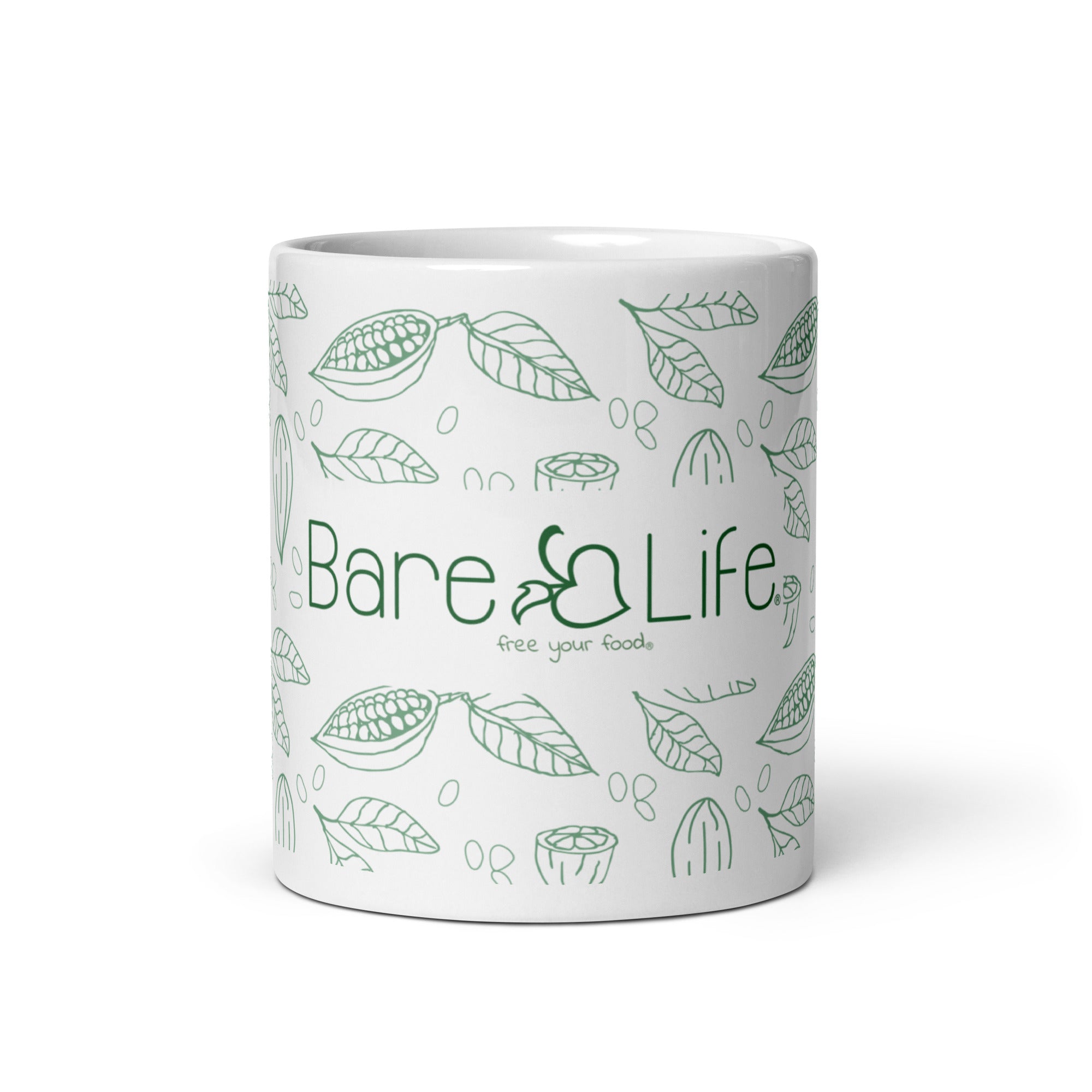 Image of a white ceramic mug featuring the Bare Life logo in green, along with the tagline 'Free Your Food.' The design includes illustrations of cacao pods, leaves, and beans, evoking a natural and organic feel. This mug is ideal for enjoying a cup of dairy-free, gluten-free, refined sugar-free, soy-free, plant-based, vegan, non-GMO, Paleo, organic, and kosher hot cocoa.